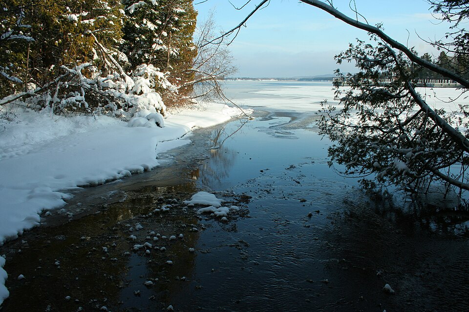 Deep snowdrifts and frozen Lake Superior harbor ice at Copper Harbor