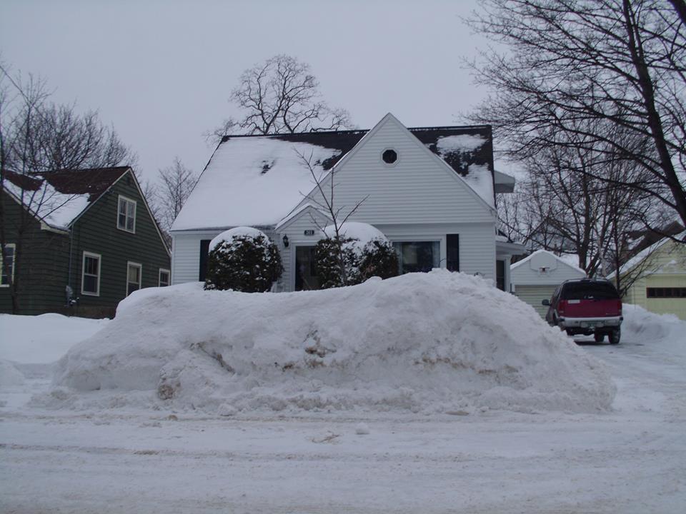 Deep snowdrifts and frozen Lake Superior shoreline in Marquette, Michigan